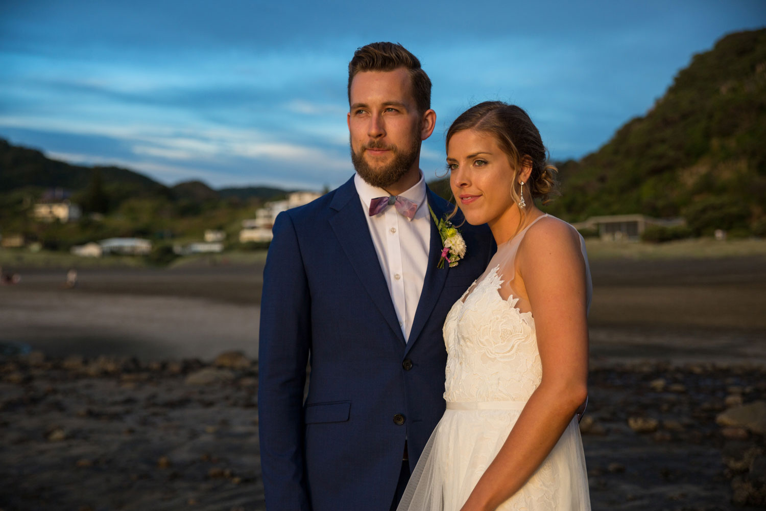 auckland wedding couple looking into the sunset