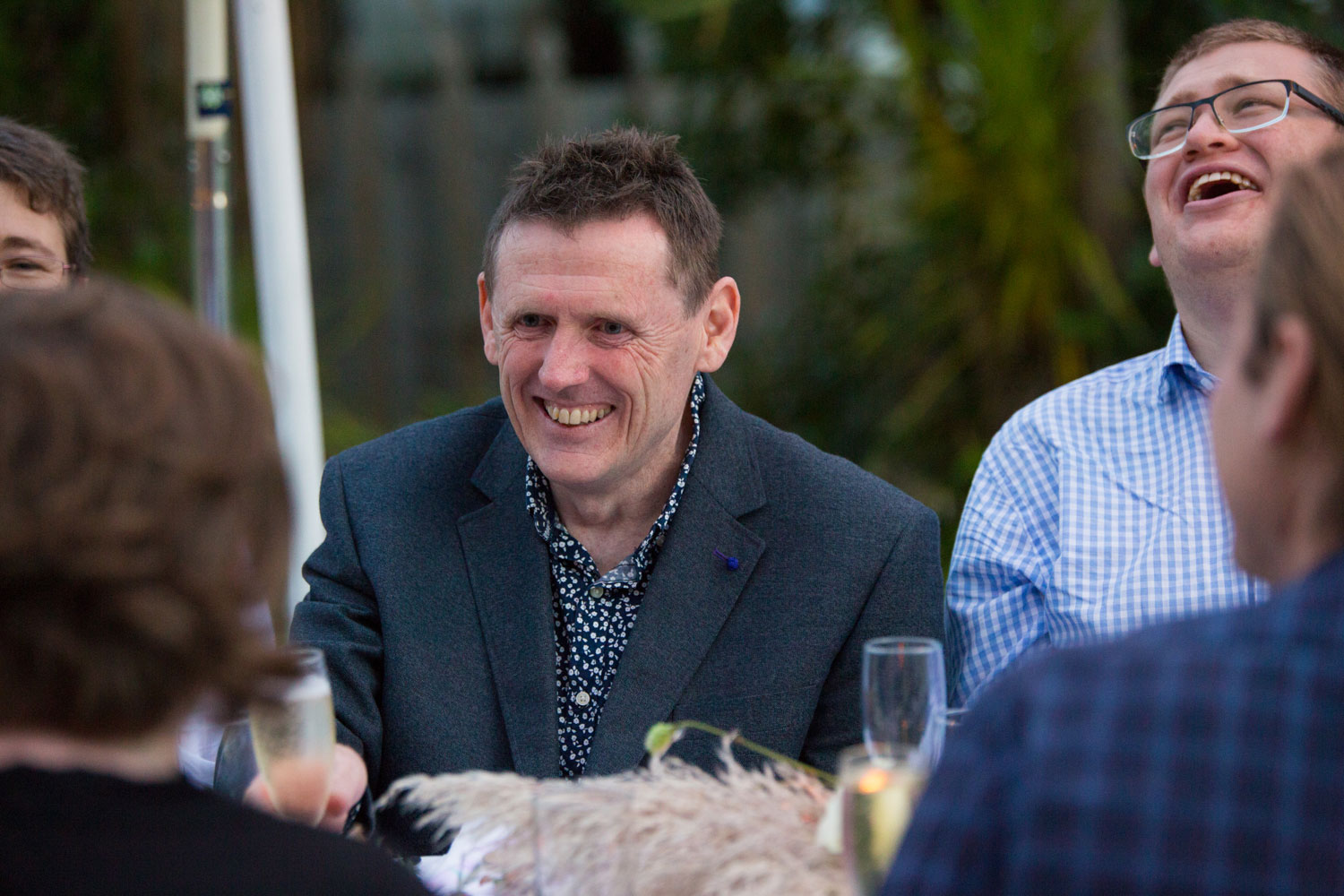 auckland wedding guest smiling at a friend