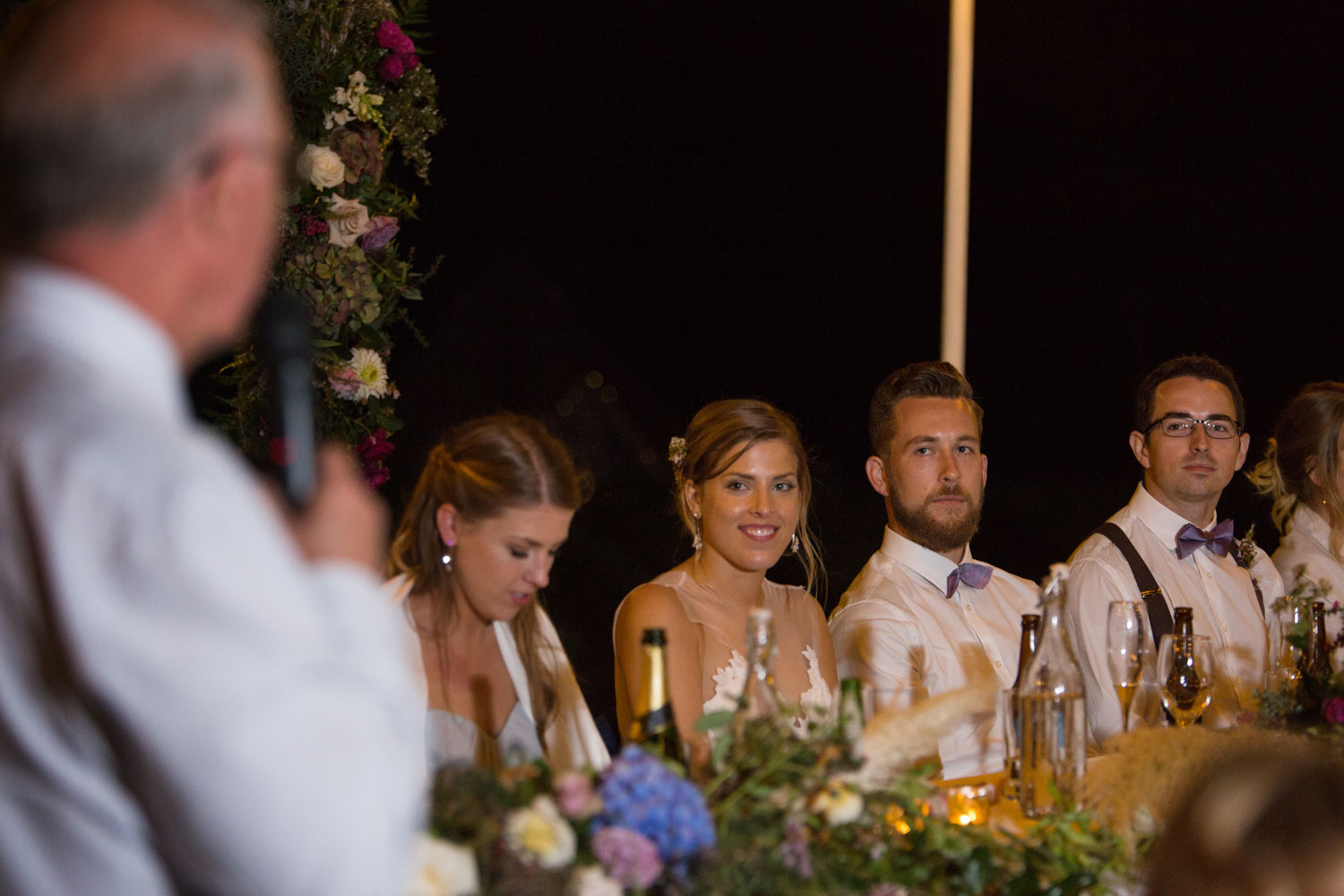 auckland wedding bride and groom listening to father's speech