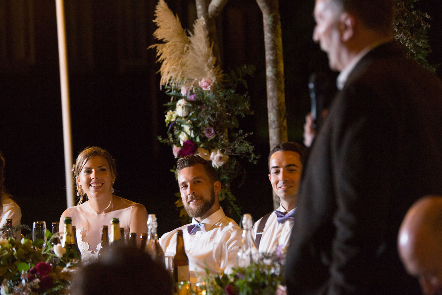 auckland wedding couple listening to speech