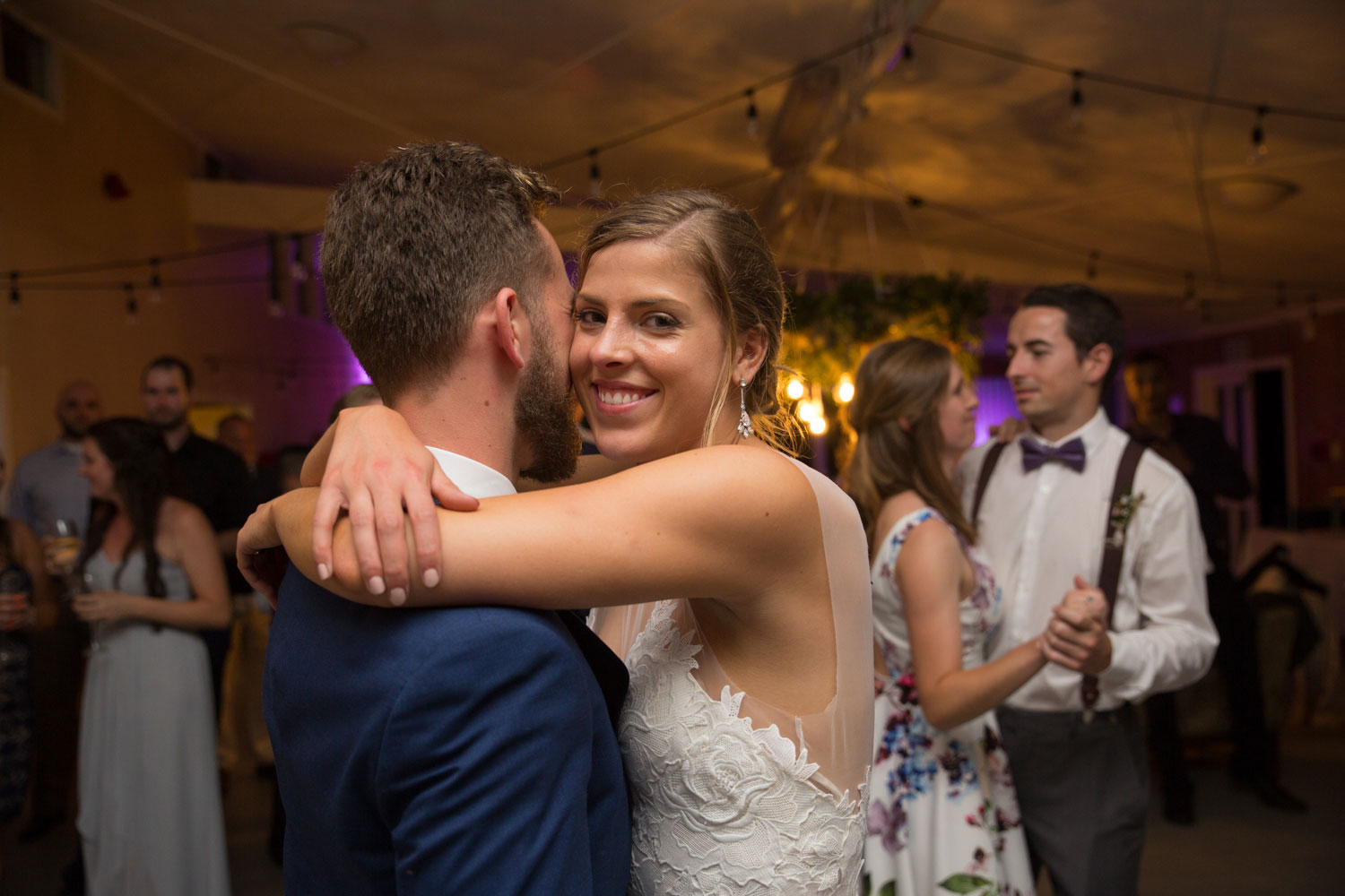 auckland wedding bride hugging groom on dance floor