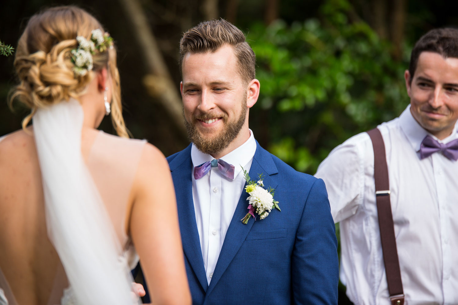 auckland wedding groom smiling at bride