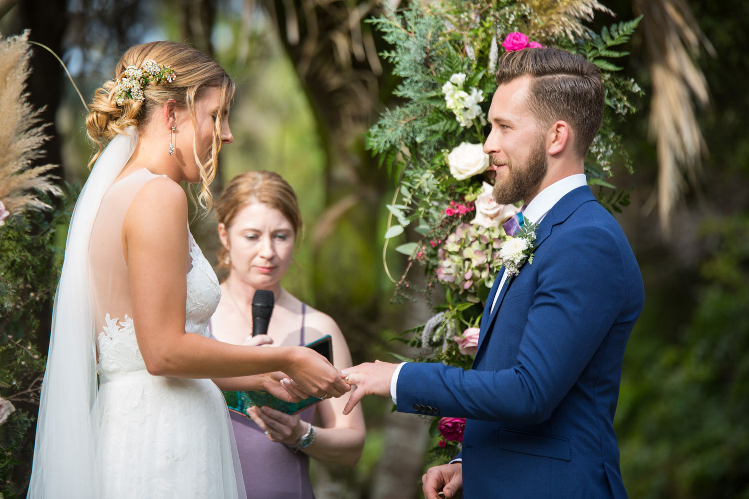 auckland wedding bride and groom hold hands