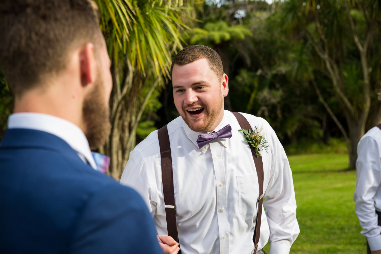 auckland wedding groomsman congratulates groom