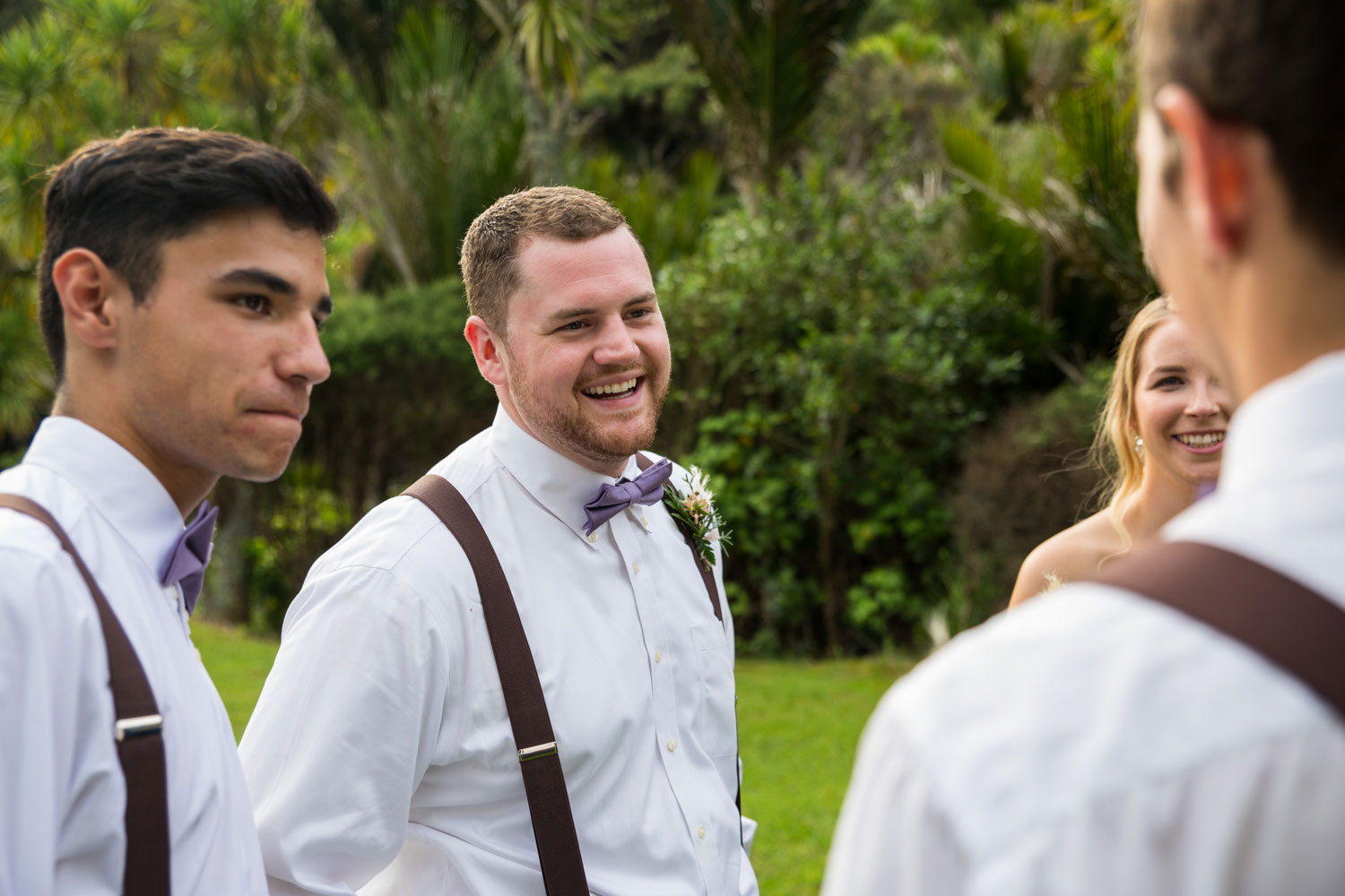 auckland wedding groomsman smiles