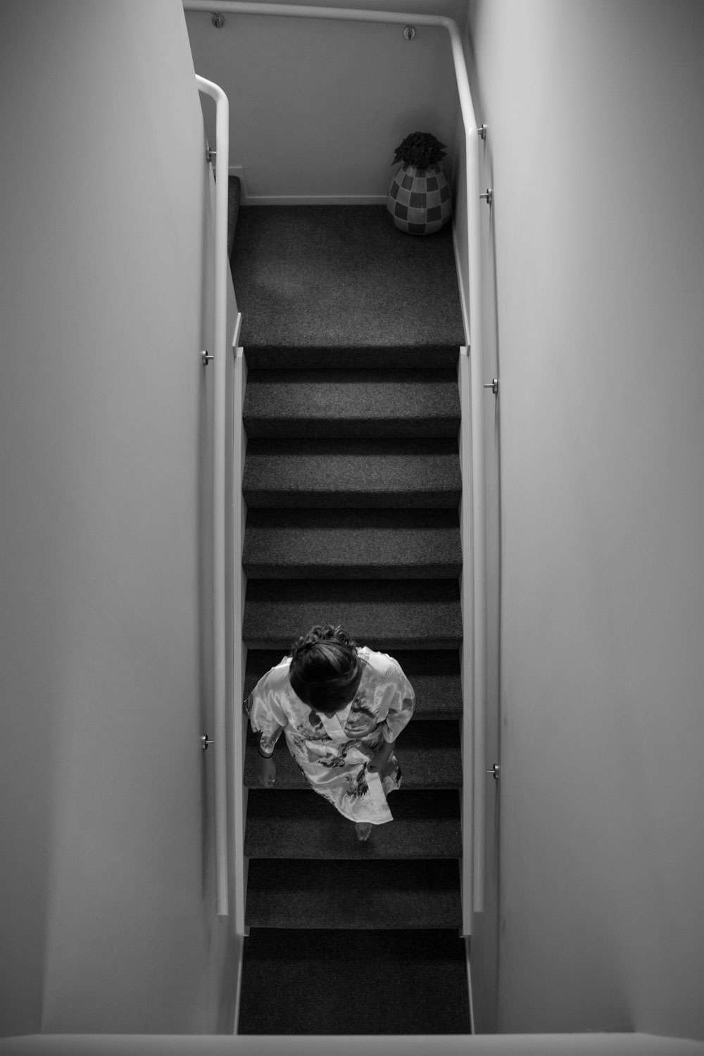 auckland wedding bridesmaid walking down stairs
