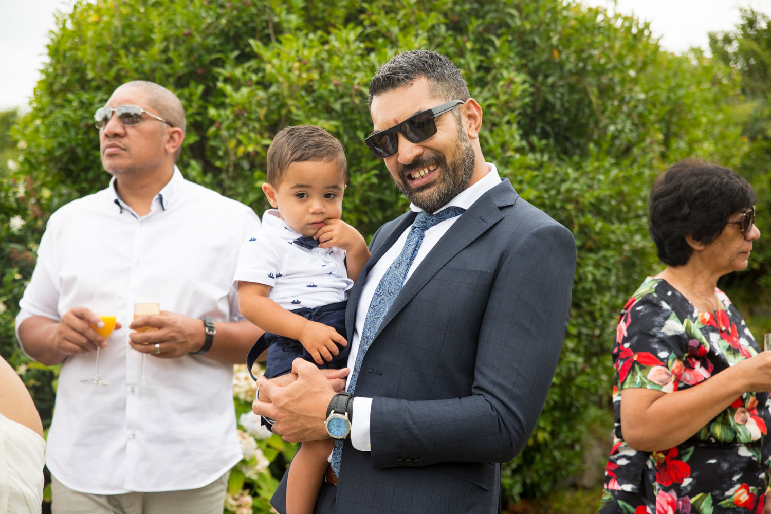 gracehill auckland wedding guest holding a boy