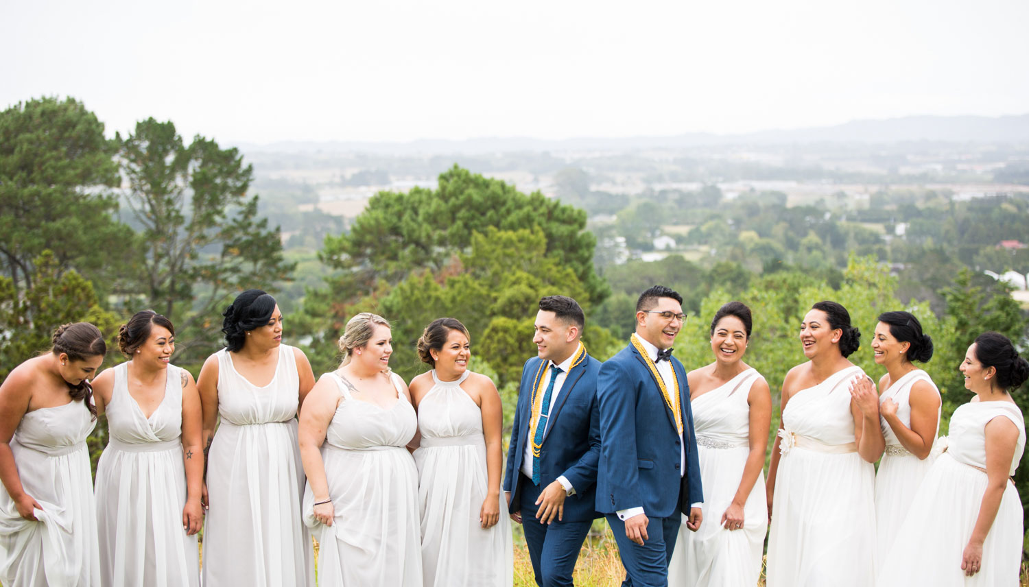 auckland wedding groom and bridesmaids talking among themselves