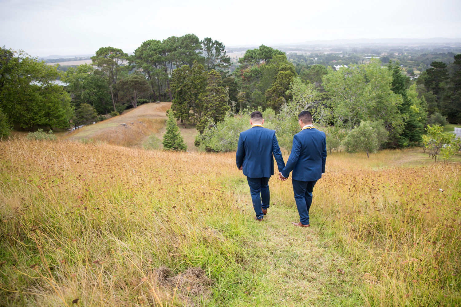 auckland wedding couple holding hands