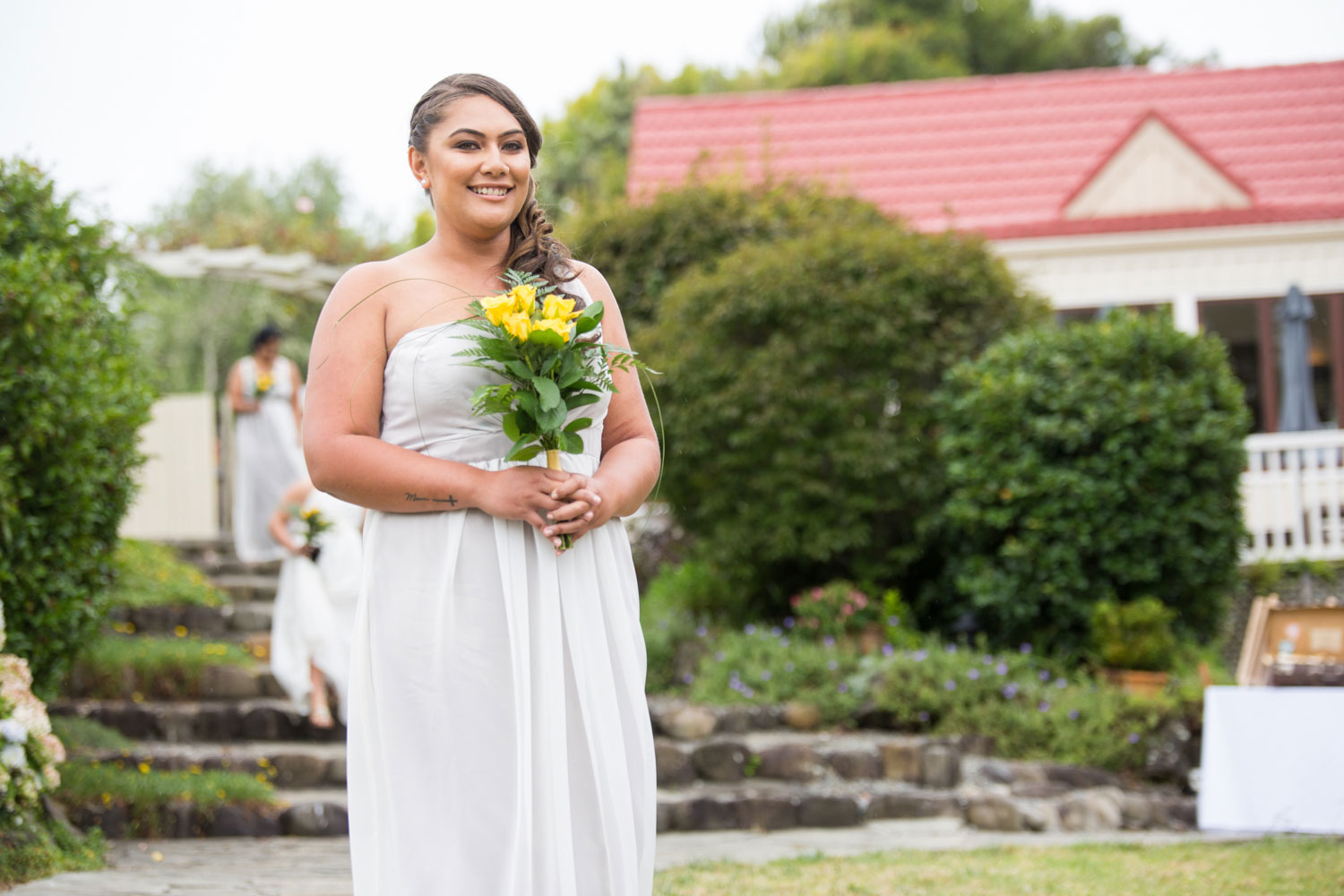 gracehill auckland wedding bridesmaid holding bouquet