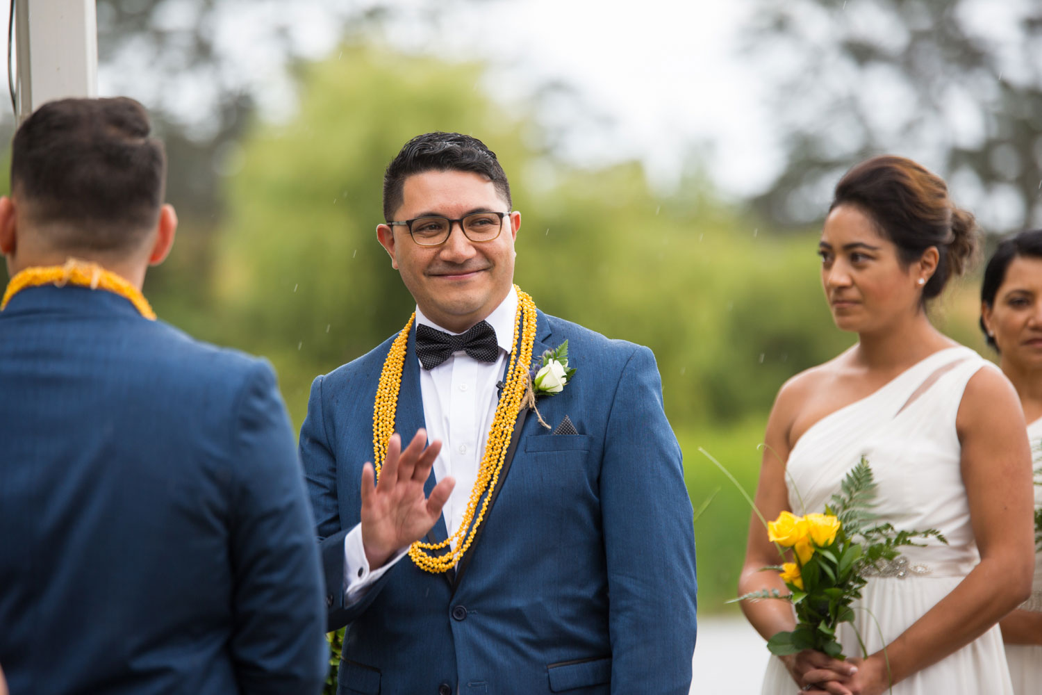 gracehill auckland wedding groom waving towards the crowd