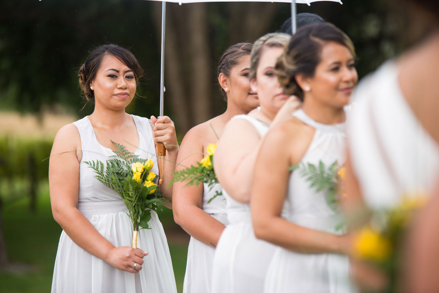 gracehill auckland wedding bridesmaids under umbrellas