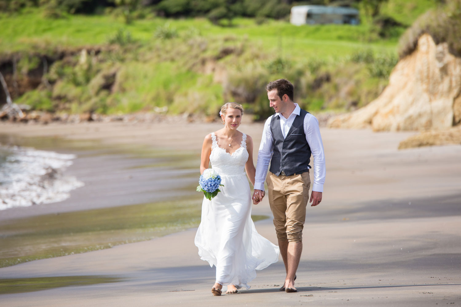 beach wedding couple walking on beach