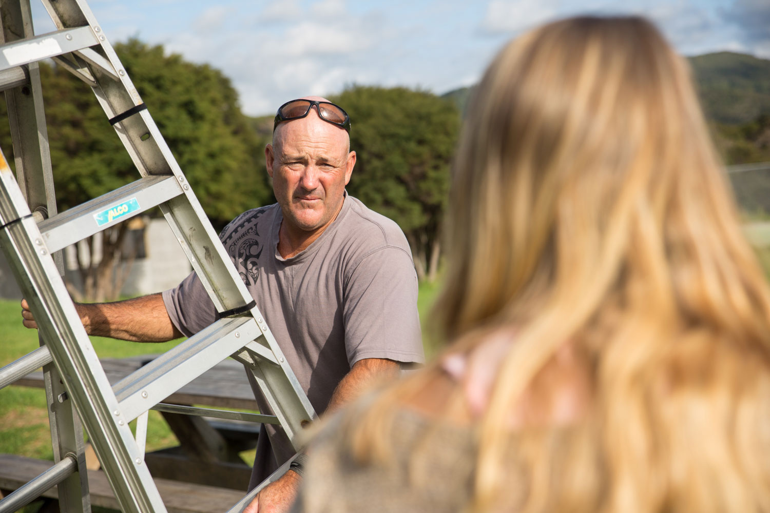 new zealand wedding man holding a ladder