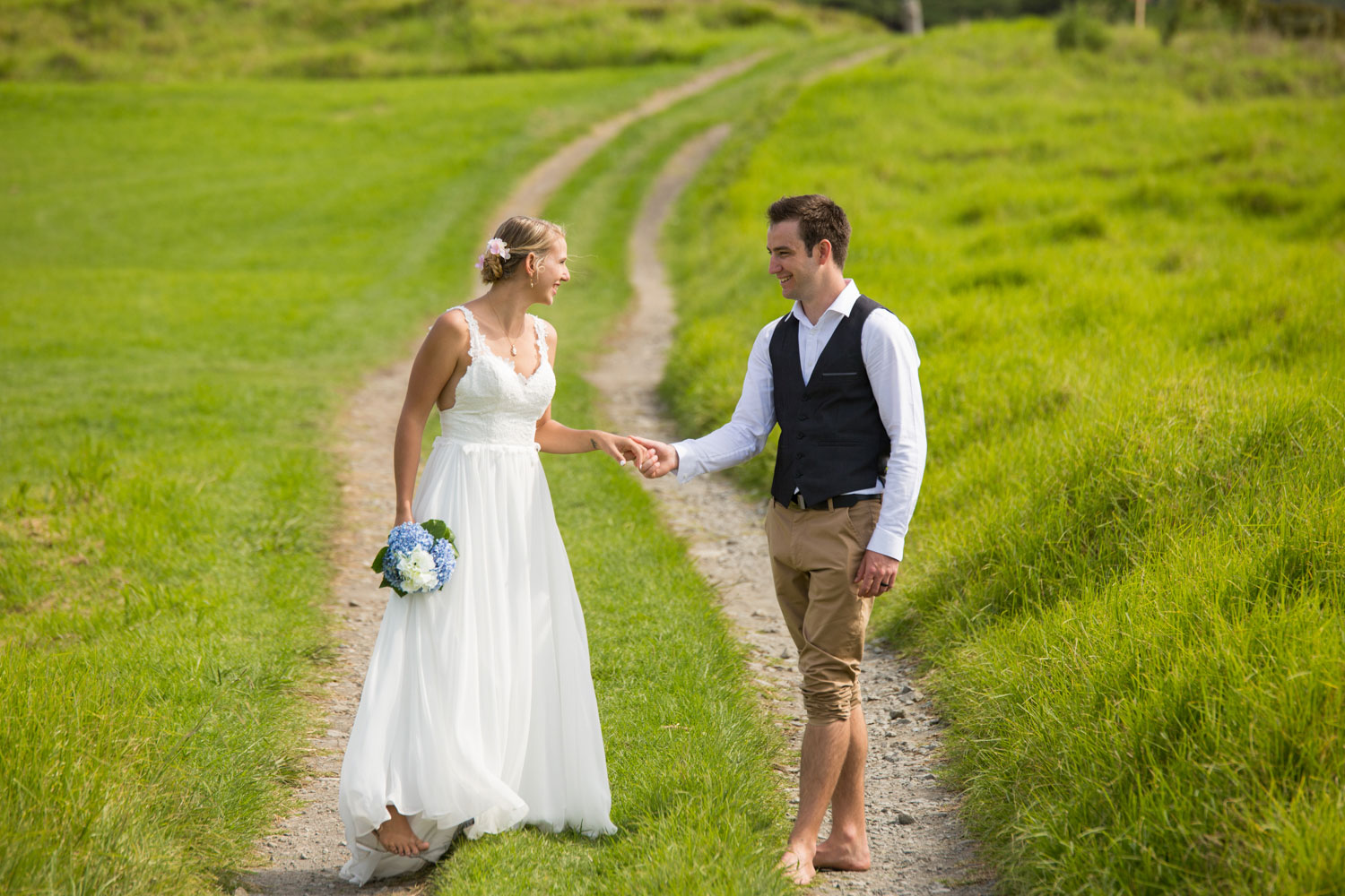 beach wedding couple teasing each other