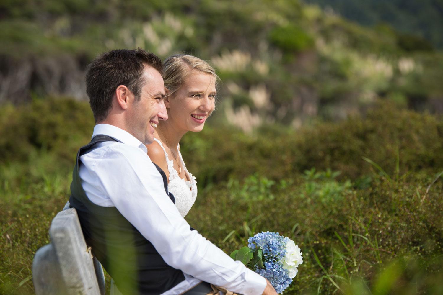 beach wedding bride and groom looking