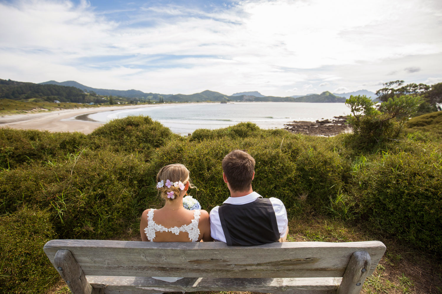 new zealand wedding couple looking at the sea