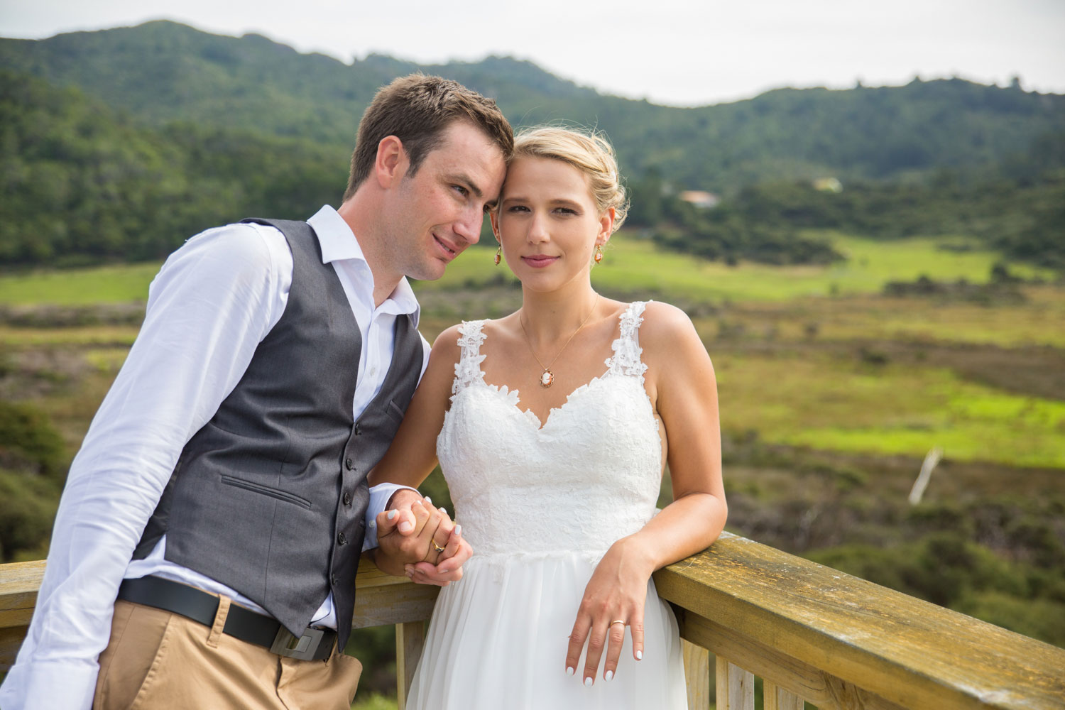 new zealand wedding groom leaning against bride