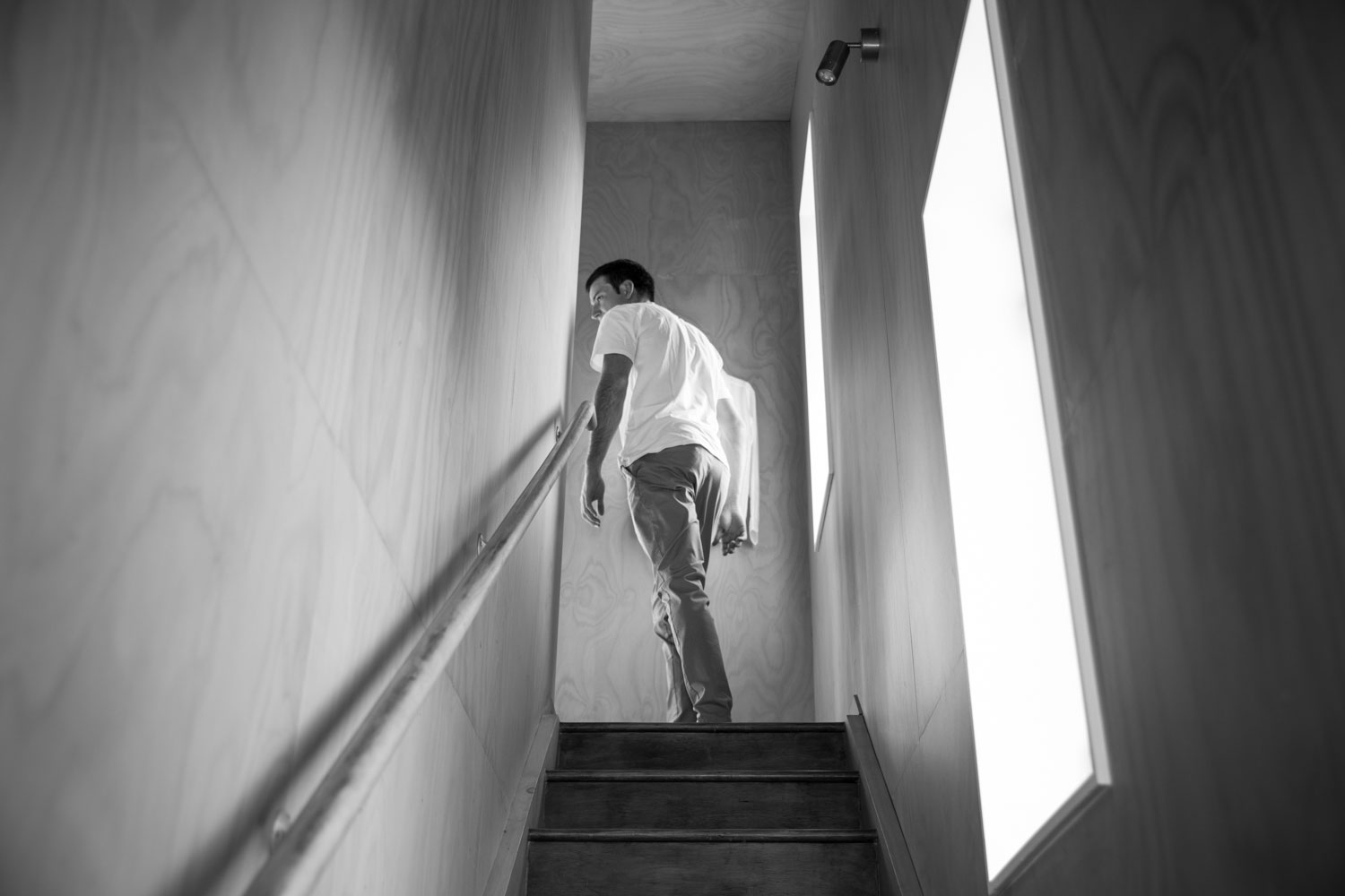 new zealand wedding groom up the stairs