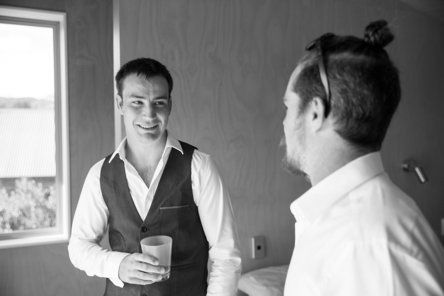 new zealand wedding groom chatting