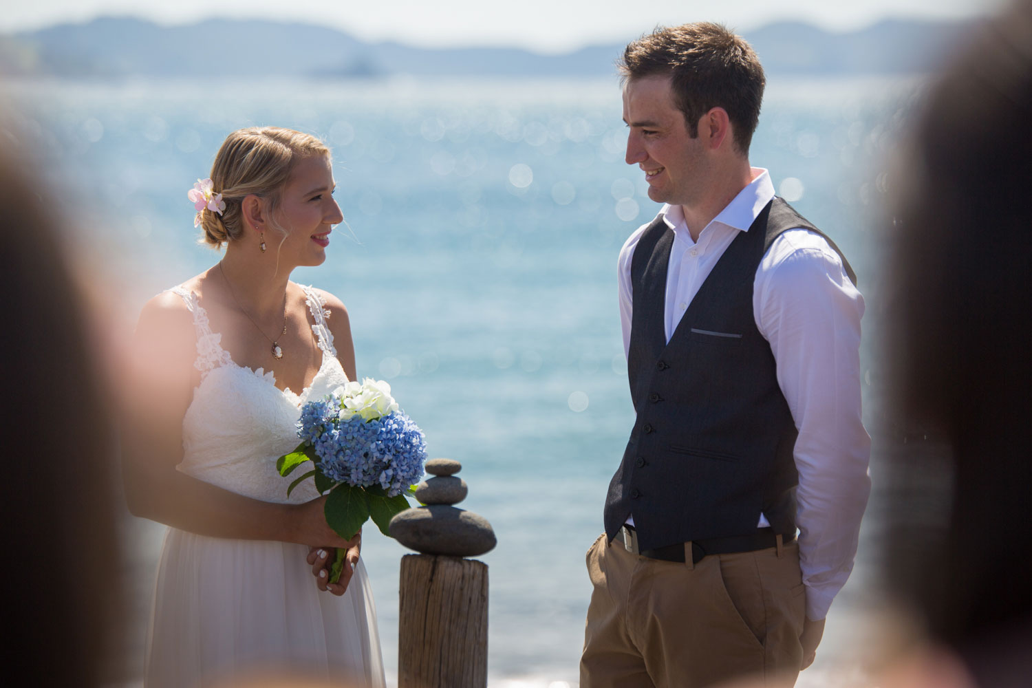 beach wedding photos groom and bride during ceremony