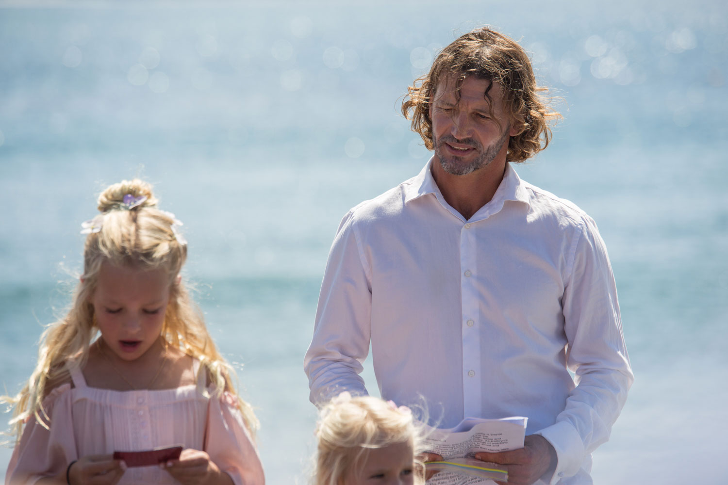 beach wedding photos celebrant looking