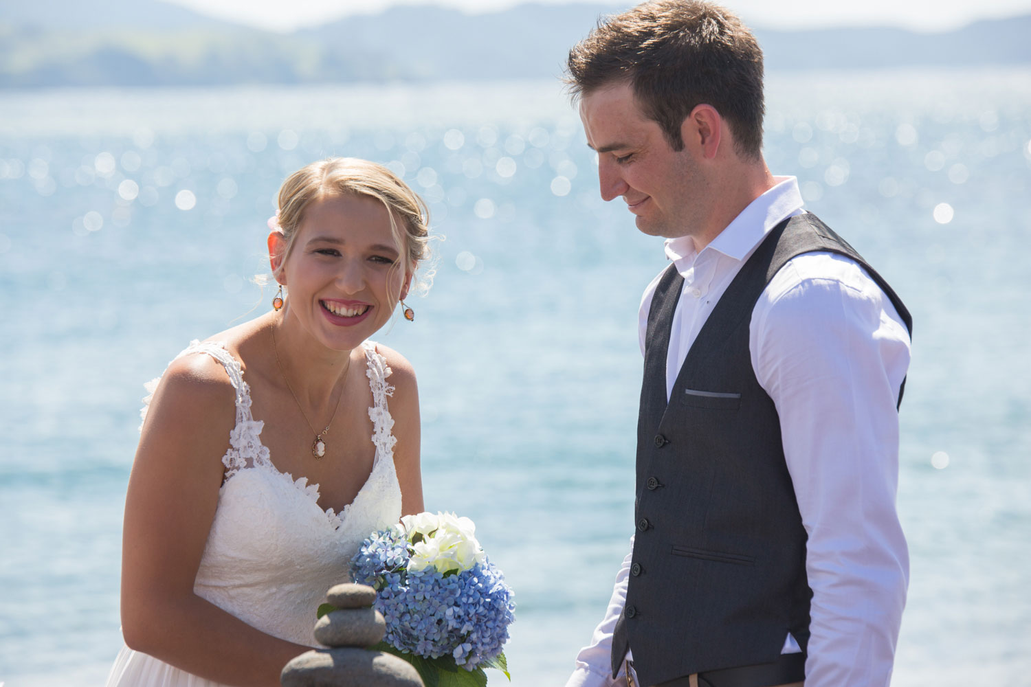 beach wedding photos bride laughing