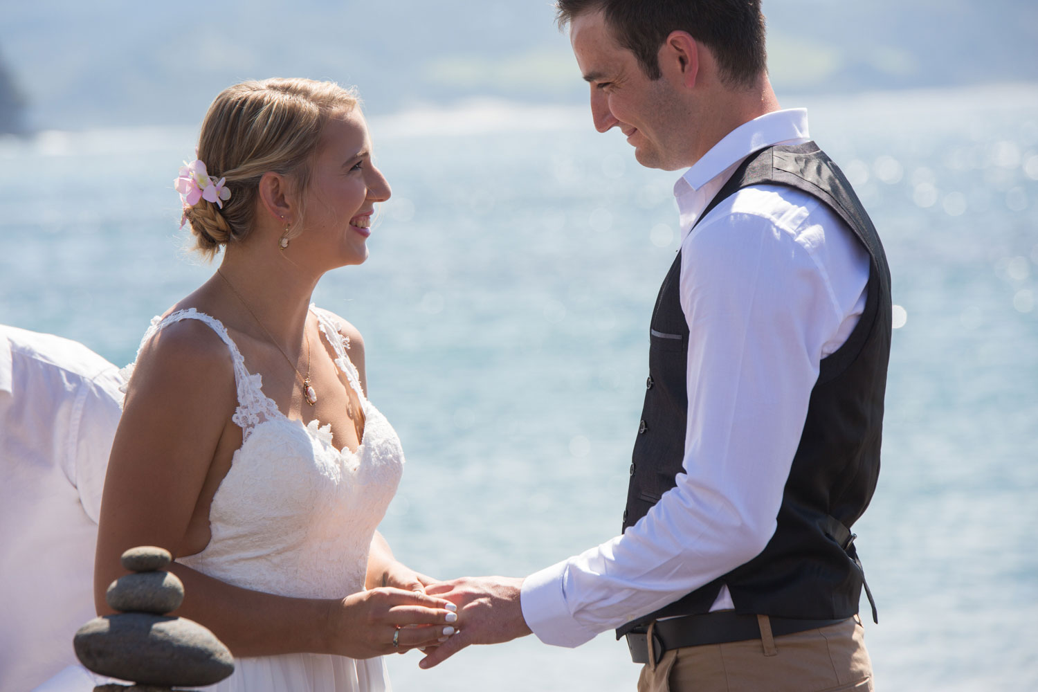 beach wedding bride and groom holding hands