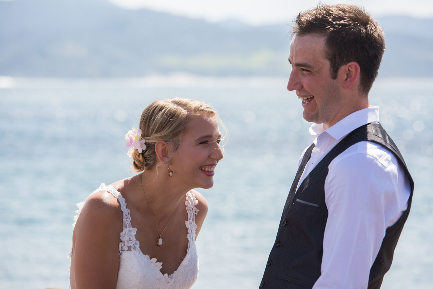 beach wedding bride laughing