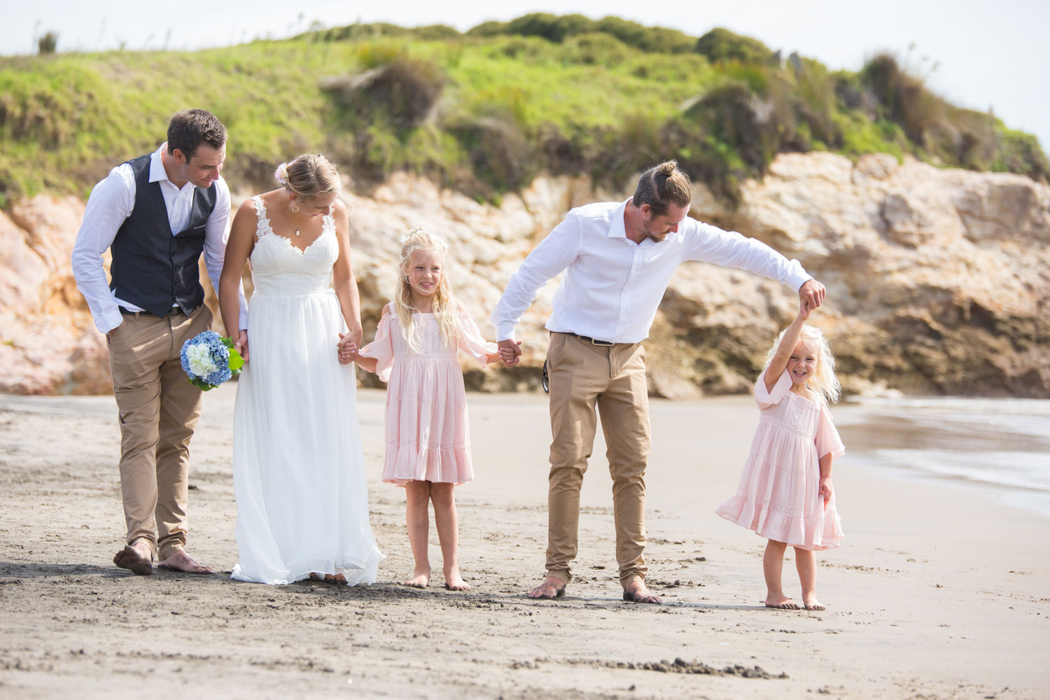 beach wedding best man and flower girl