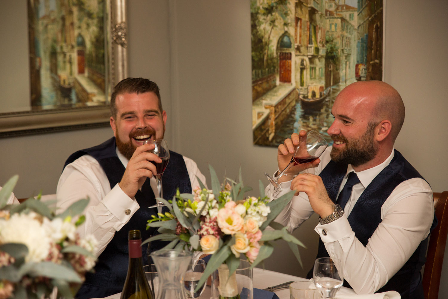 wedding photography auckland groomsmen drinking and laughing