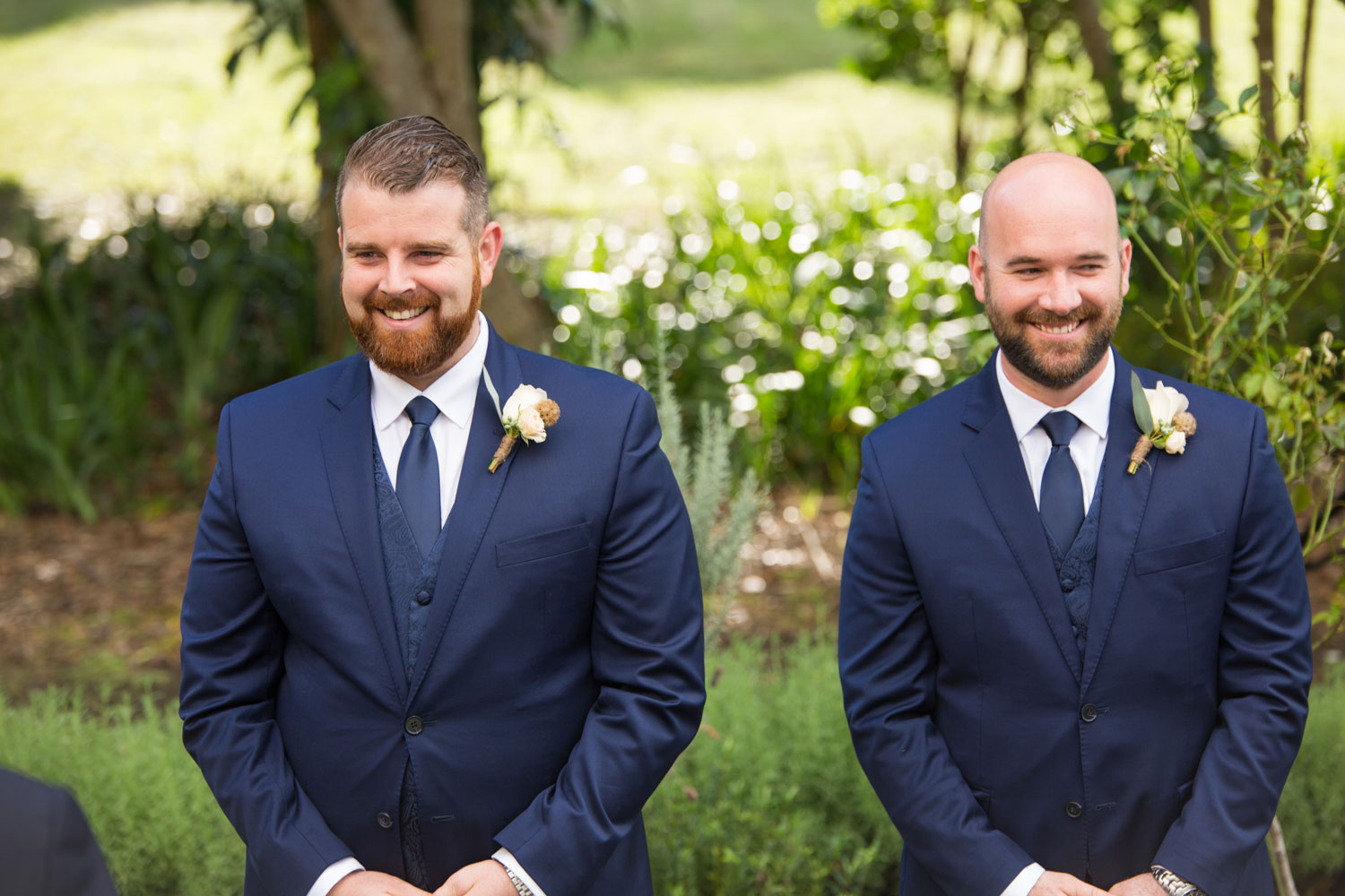wedding photographer auckland groomsmen smiling