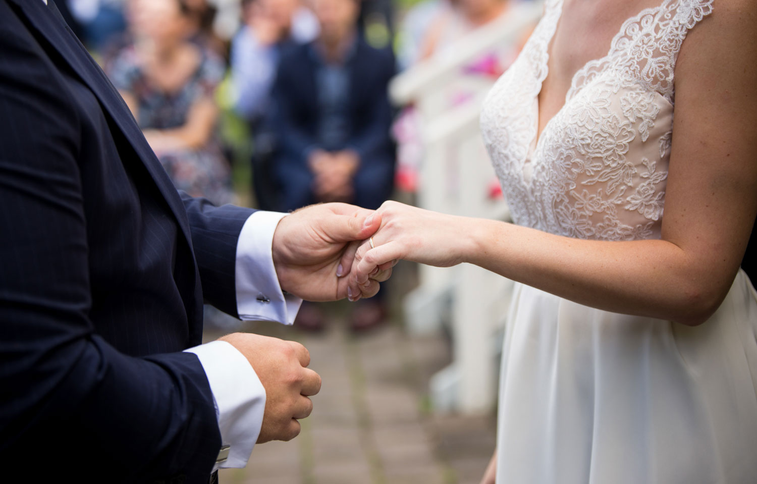 wedding photographer auckland groom holding bride hand