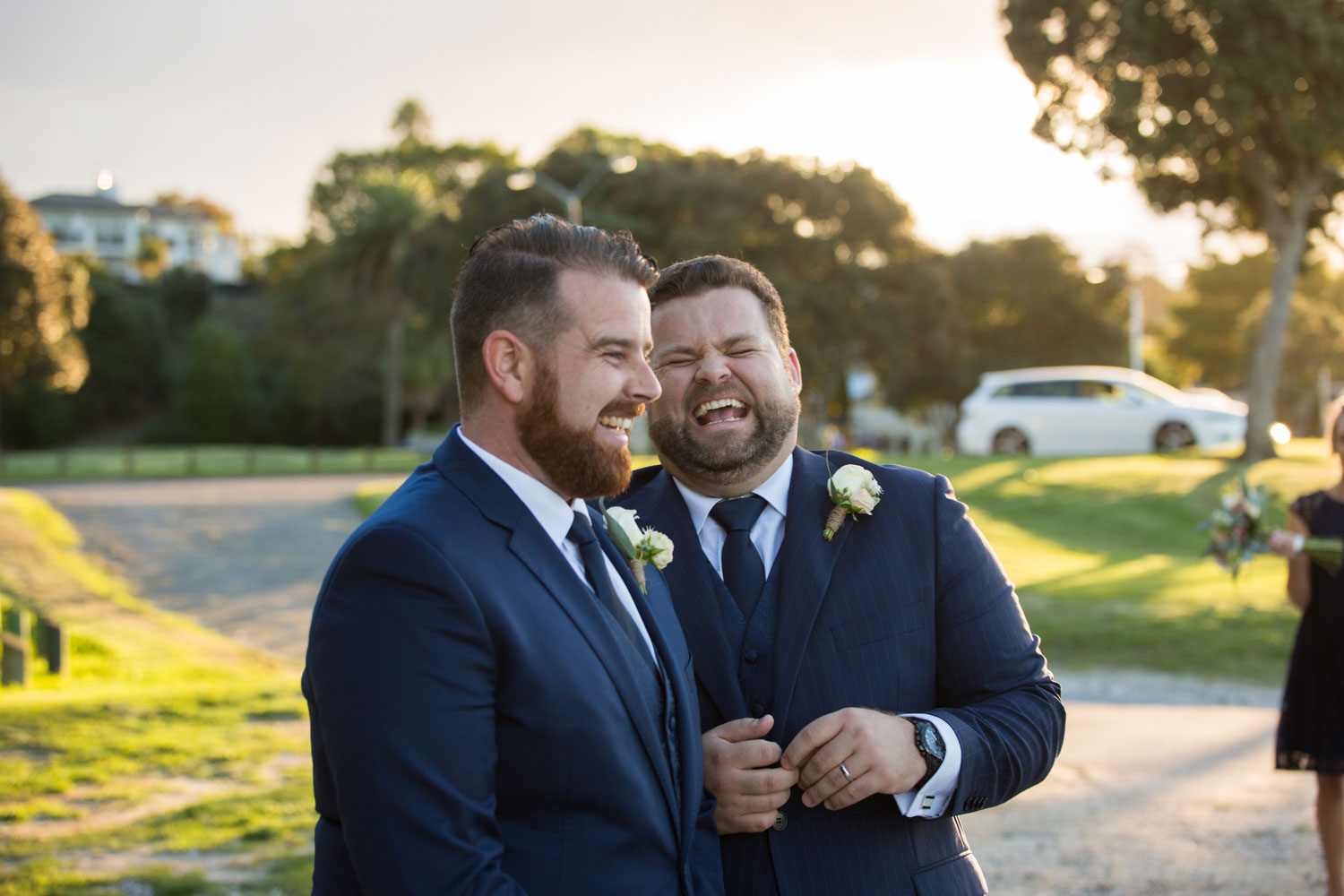 wedding photographer auckland groom and best man having a laugh