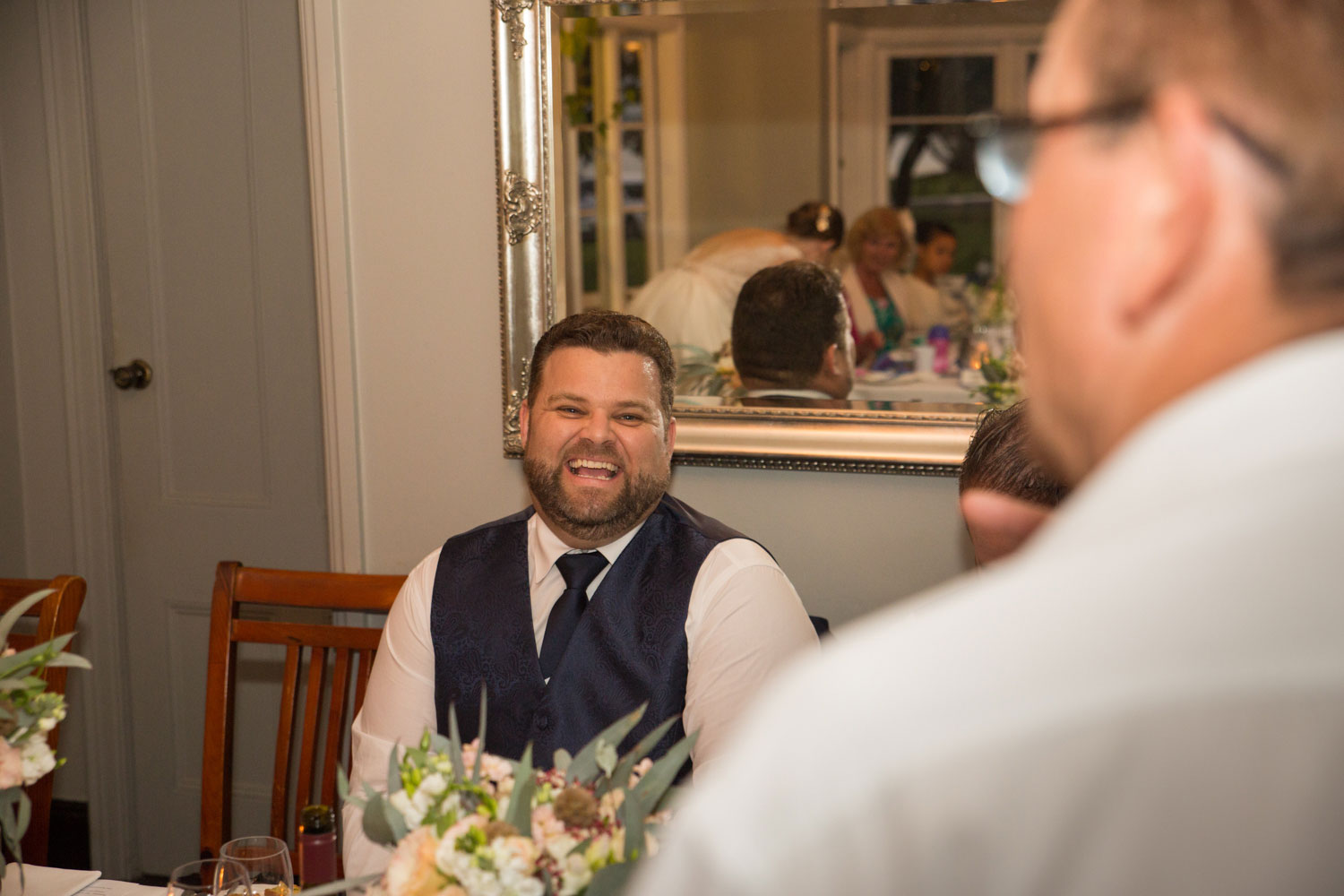 wedding photographer auckland groom laughing
