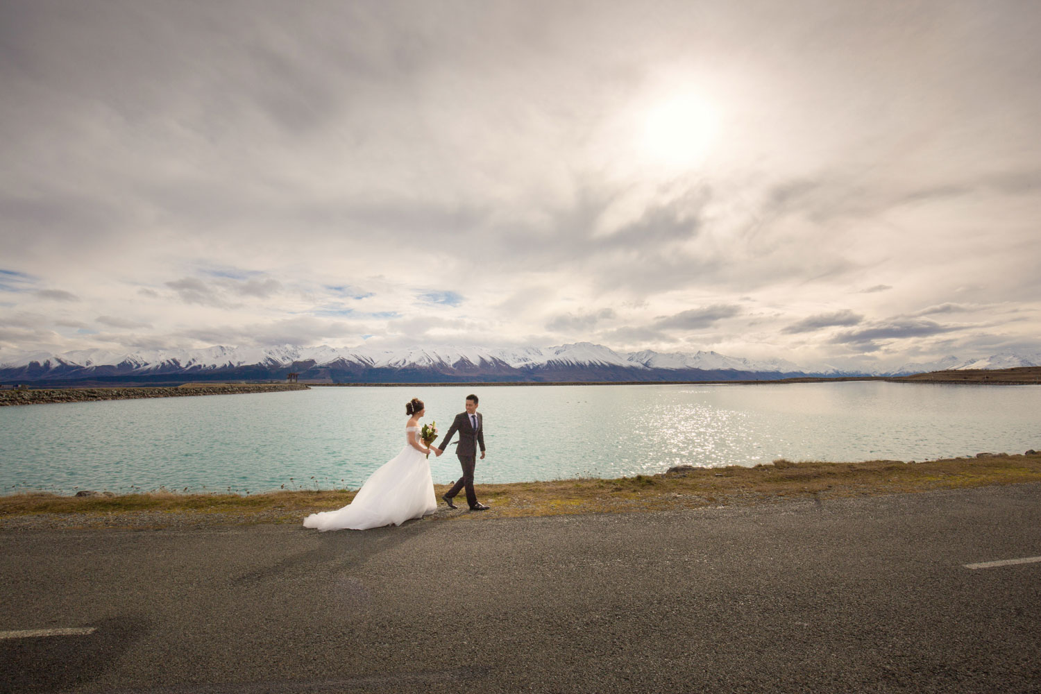 new zealand pre-wedding couple walking along lake