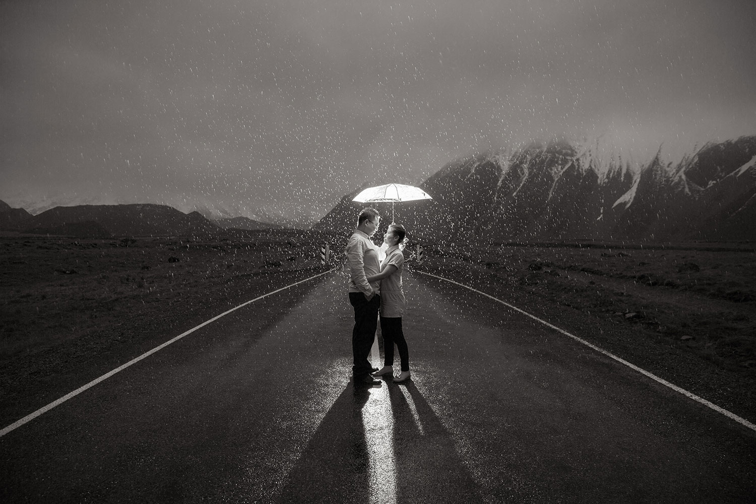 new zealand pre-wedding photo couple in the rain black and white