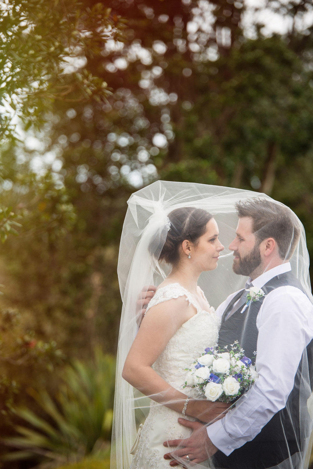 auckland wedding couple in veil