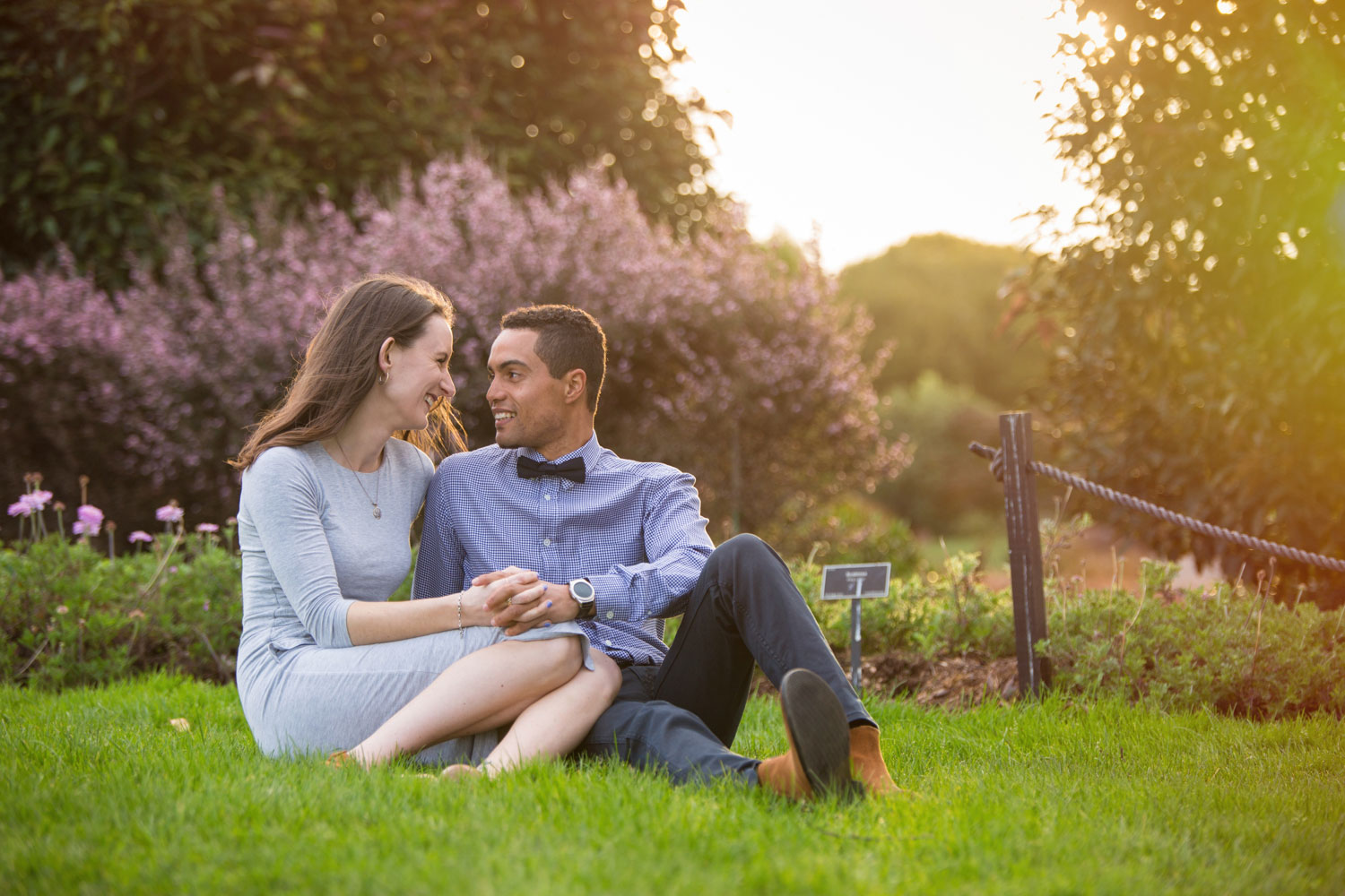 auckland botanic gardens engagement photo couple looking at each other
