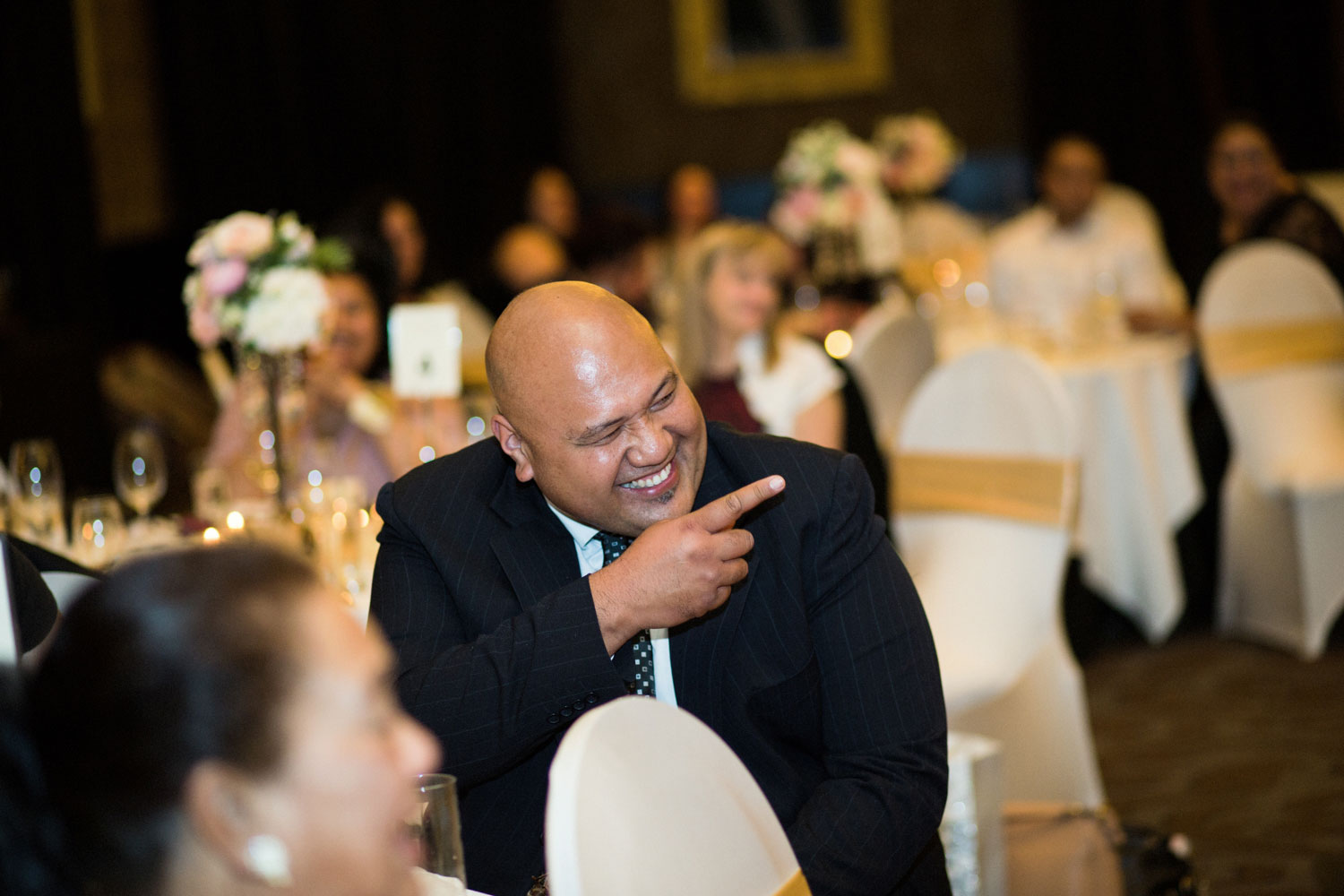 the langham auckland wedding reception guest laughing