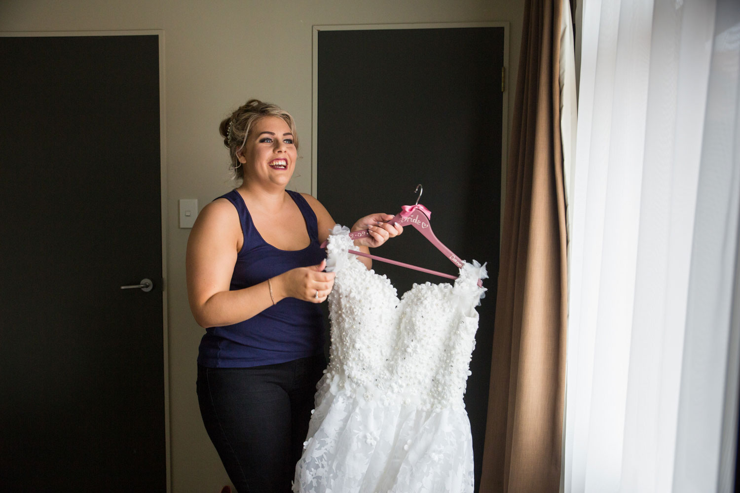 hamilton wedding bride looking at her dress