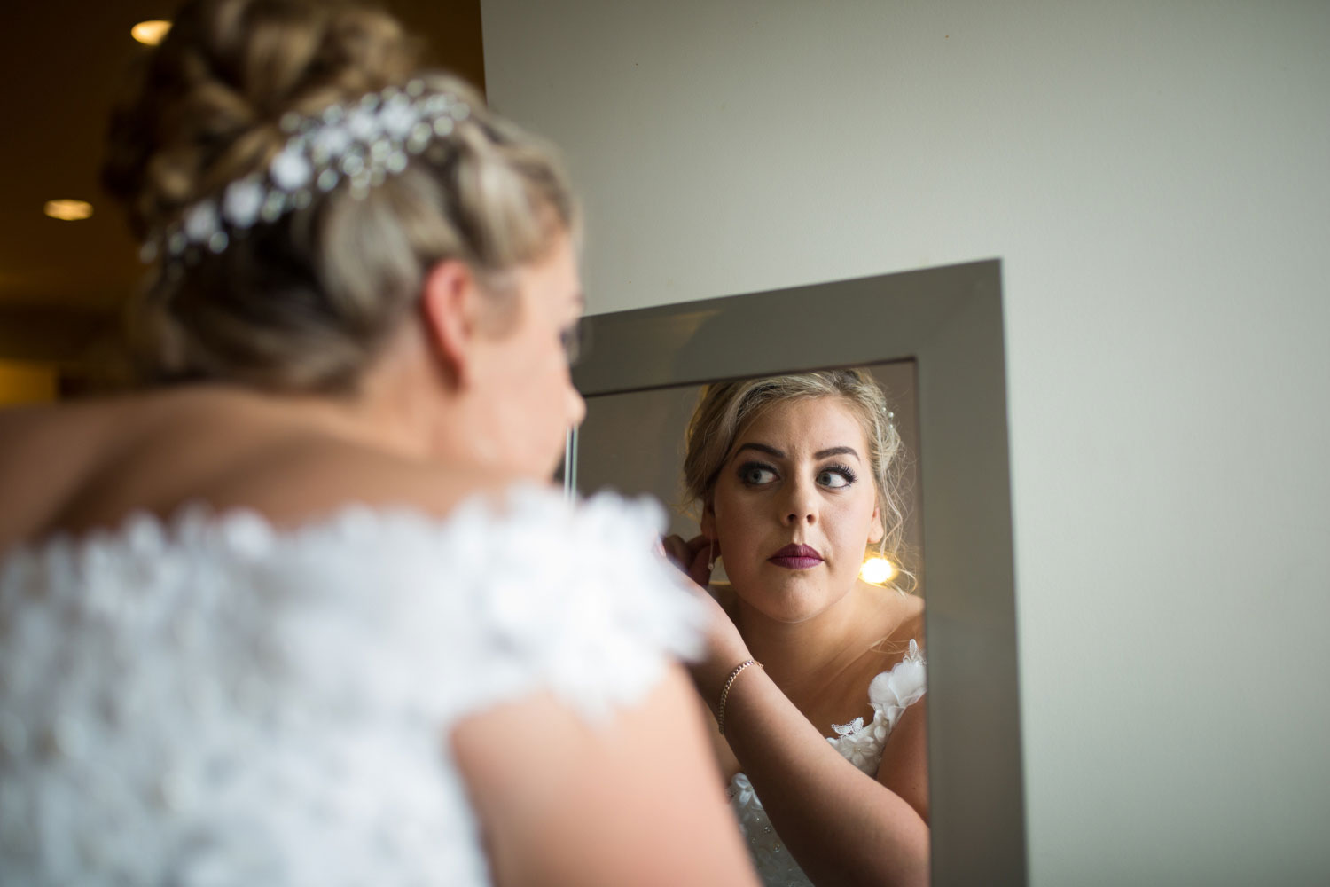 hamilton wedding bride looking into the mirror