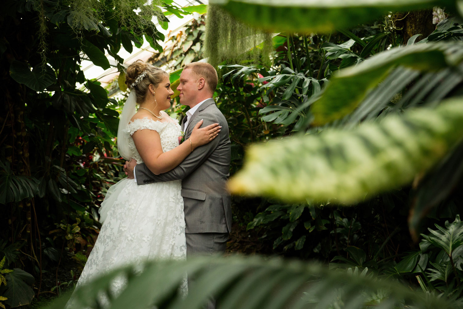 hamilton wedding couple embracing beside tree