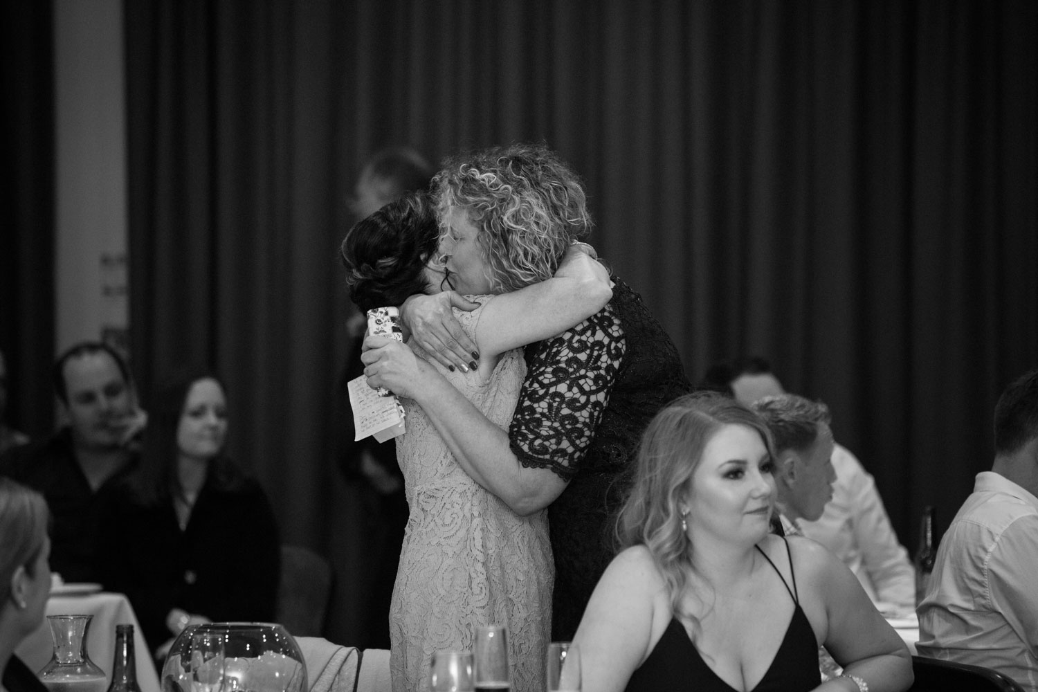 hamilton wedding mothers of the bride and groom embracing