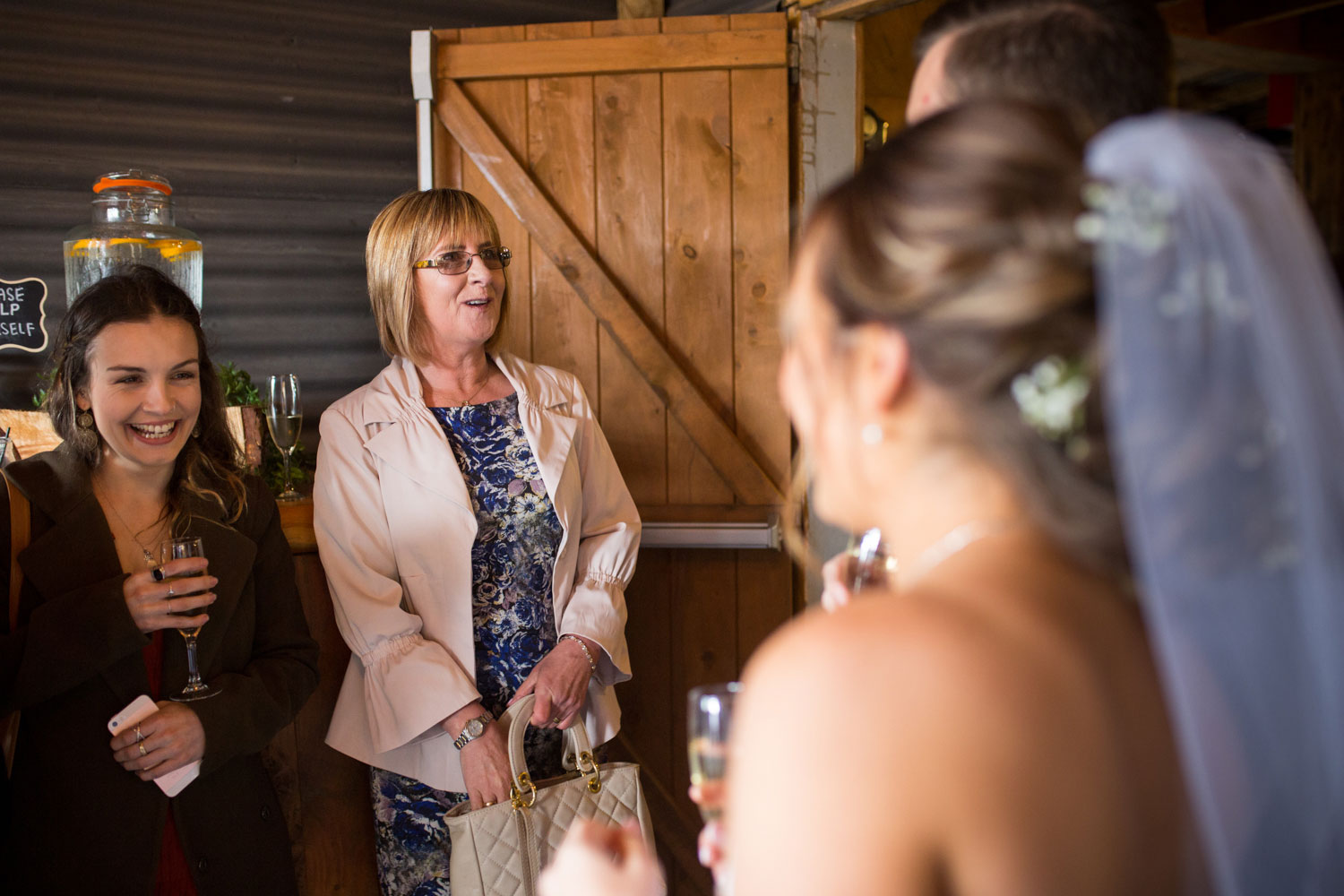 the red barn waikato wedding guest chatting