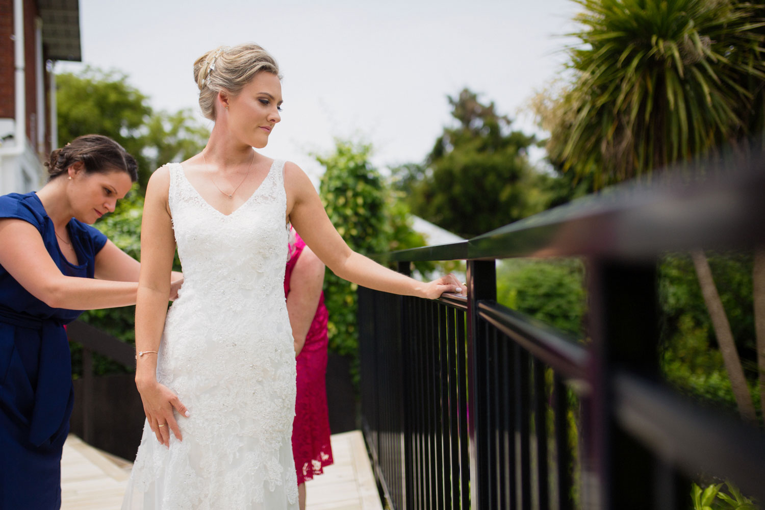 bride putting on her dress