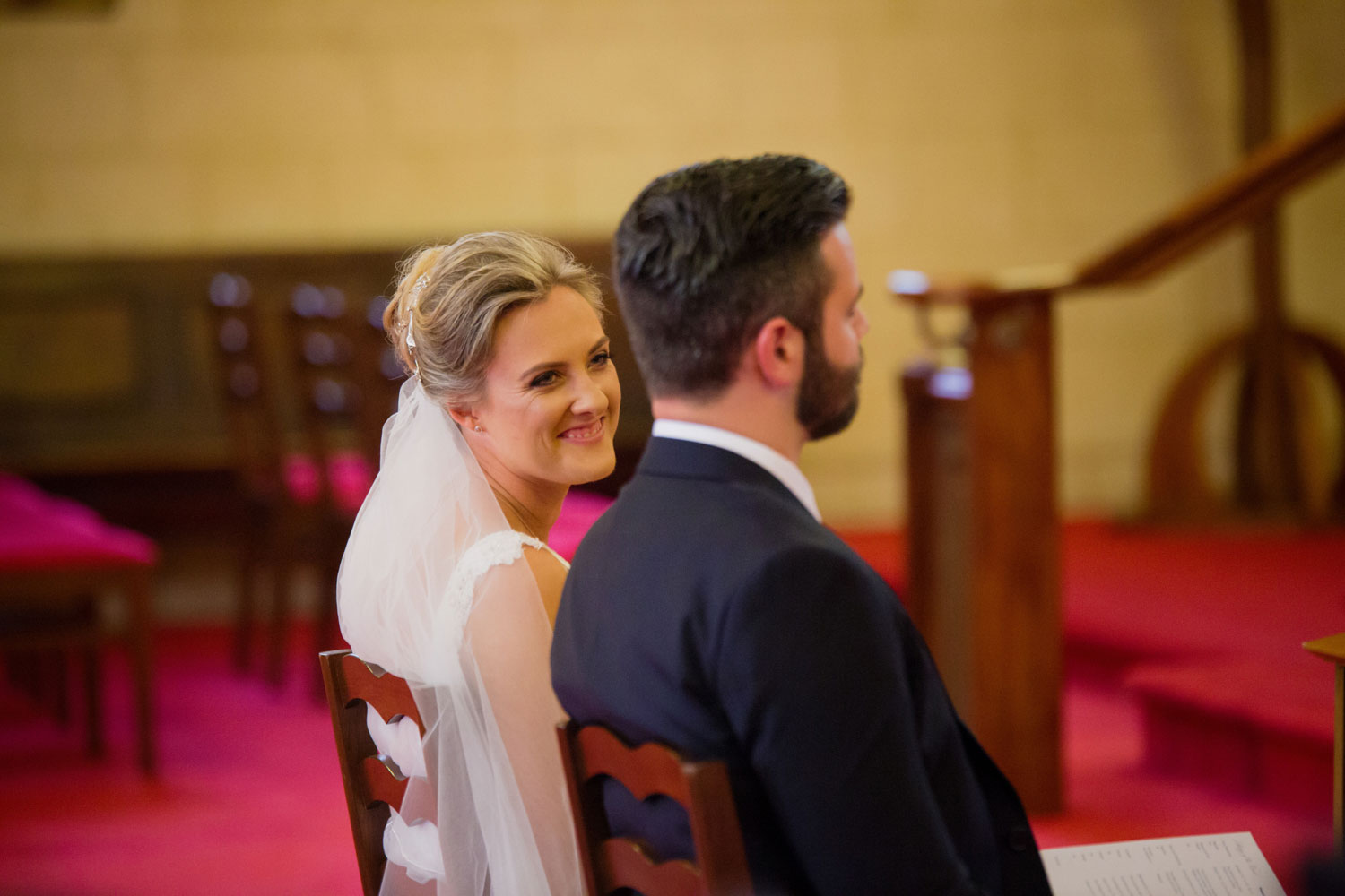 bride smiling at the groom