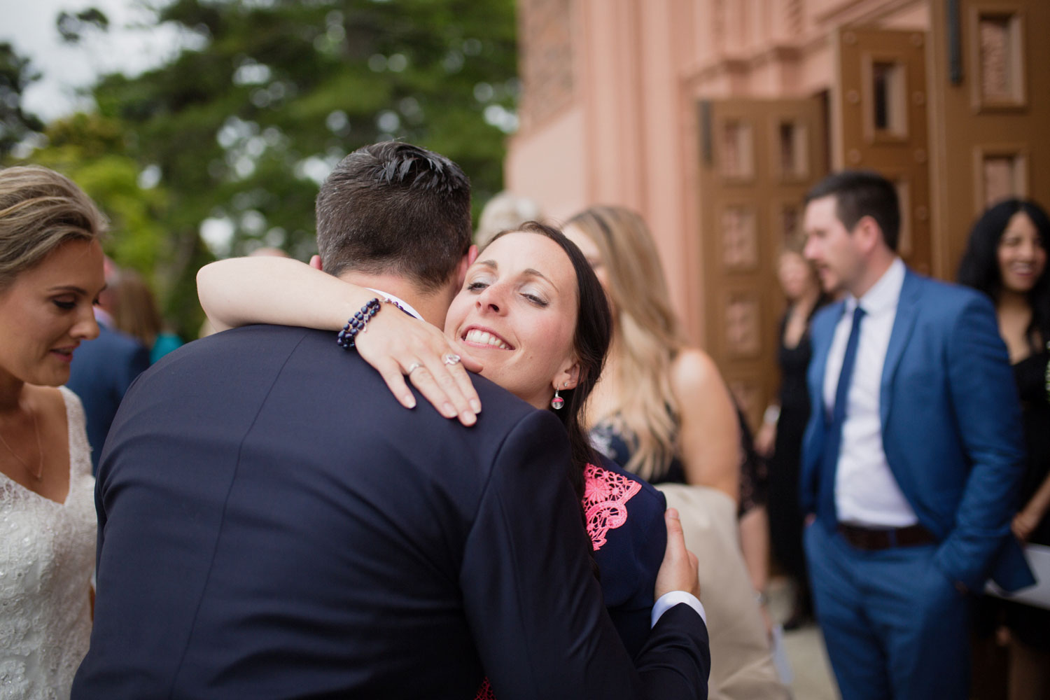 wedding guest hugging