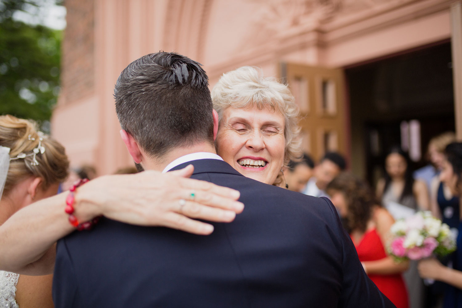 guest hugging groom