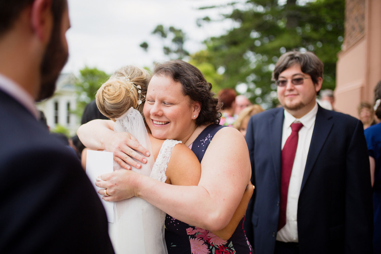 wedding guest hugging